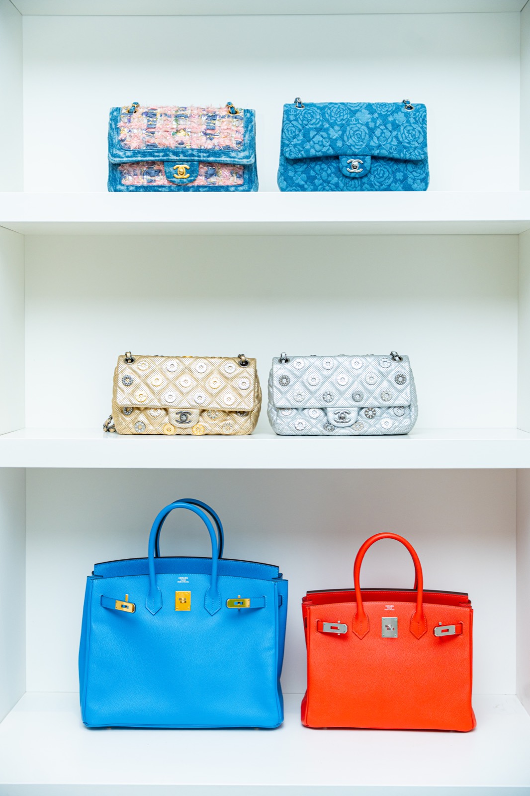 A private closet of collected handbags.